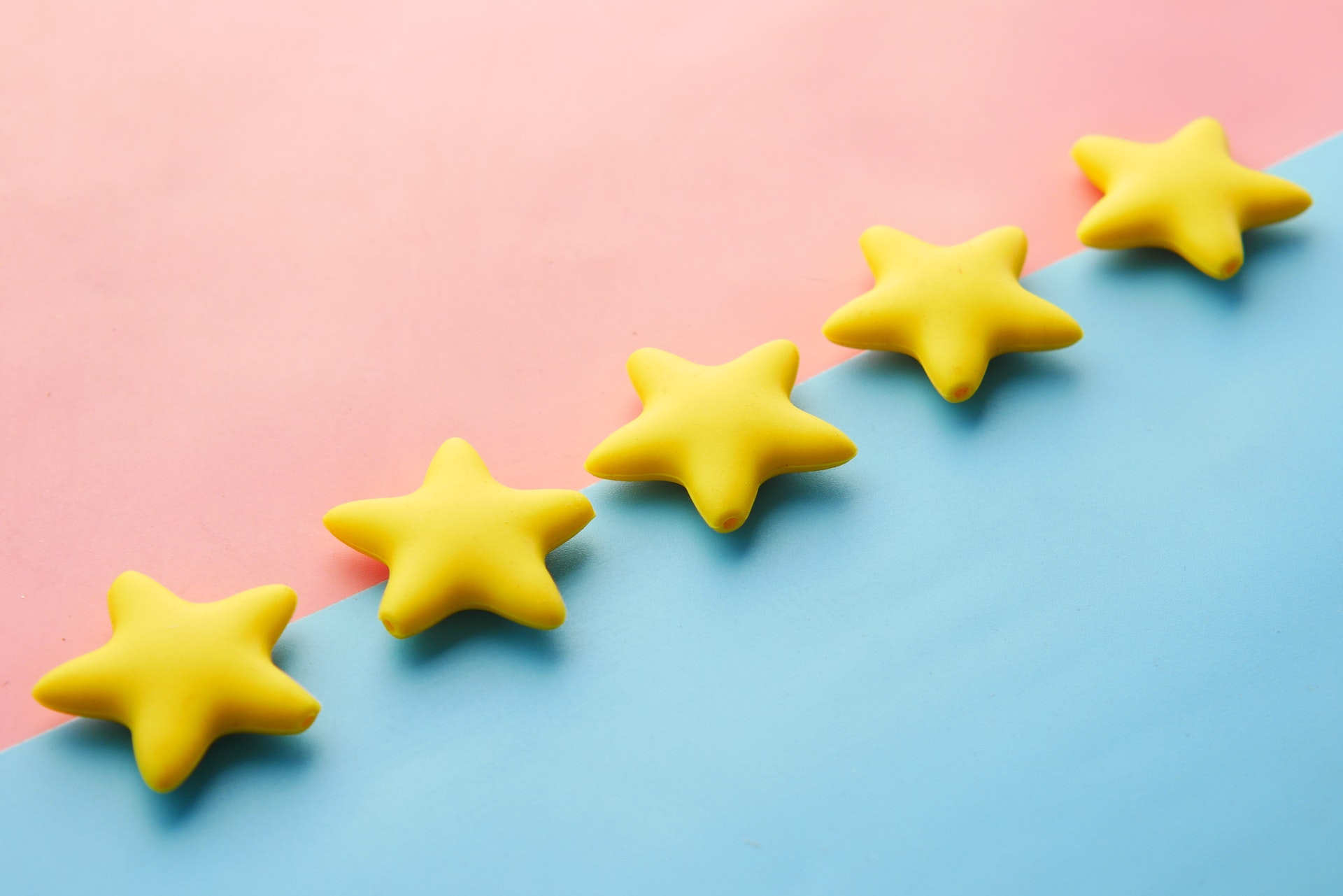 3-D stars on a pink and blue background